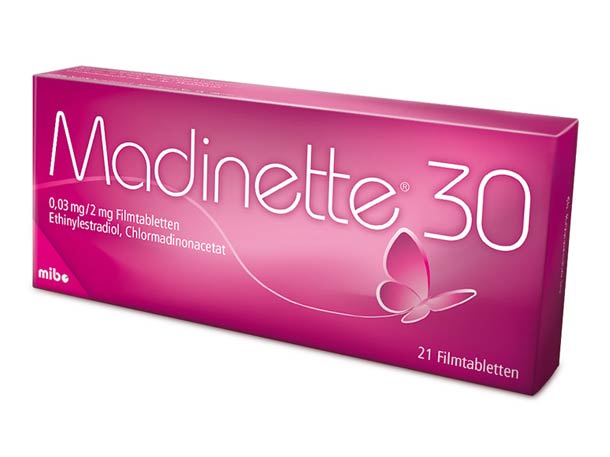 Eine rosafarbene Schachtel mit Madinette 30 Verhütungspillen mit Schmetterlingsmotiv und weißem Text, die 21 Filmtabletten enthält.